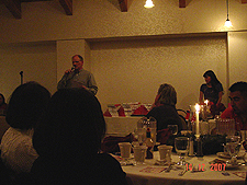 Dean gives his speech with Pat at right