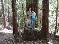 Ryan and Stella on a stump.