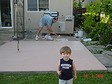 Hunter supervising daddy's painting.