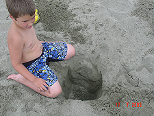 Tyler digging his sand hole...