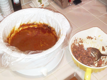 The sauce in the crockpot after most of the meat has been removed and spooned into the burritos.