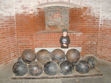 Hunter behind big cannon balls