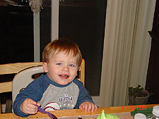 Hunter eating cake.