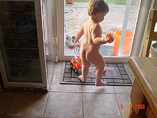 Hunter playing with his car.