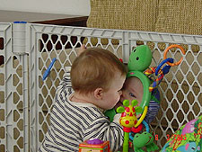 Hunter kissing the cute baby in the mirror.