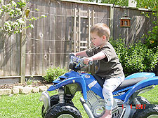 Hunter riding his ATV