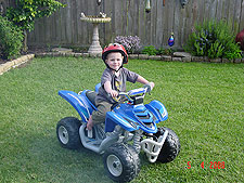 Hunter riding his ATV