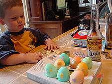 Hunter decorating eggs.