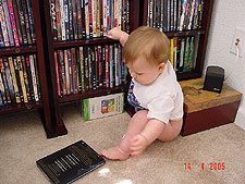 Checking out his movie selection.