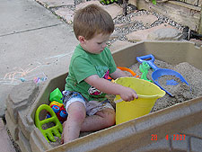 Hunter playing in his sand box.