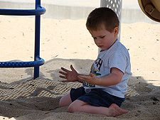 Hunter playing in the sand