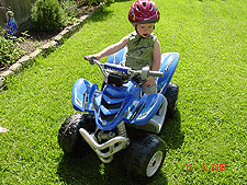 Hunter riding his ATV