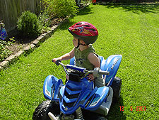 Hunter riding his ATV