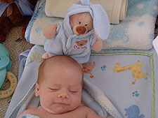 Napping with his new bear.