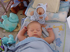 Napping with his new bear.