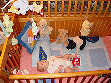 Hunter hanging out in his crib.