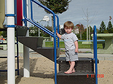 Hunter ready to go down the slide.