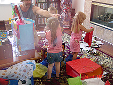 Jordan and Olivia help Hunter open presents...