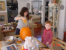 Heidi and Hunter cleaning the pumpkin.