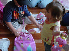 Tyler helps Jordan with her presents.