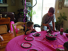 Tyler cuts the birthday cake