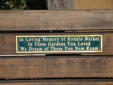 a memorial plaque on a bench