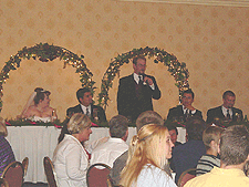 Austin toasts the bride and groom.