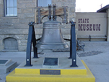 Bell outside museum.