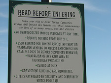 Cemetary sign -- Note the uplifting poem at the bottom.