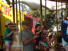Dave and the boys on the carousel.
