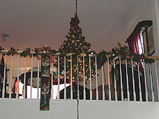 Rudolph-topped tree in loft.