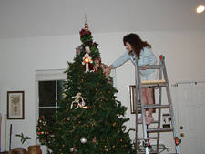 Heidi decorating the tree.