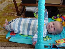 Hunter playing on his mat.