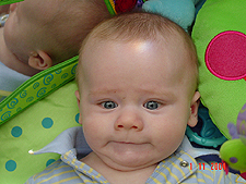 Hunter playing on his mat again.