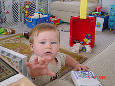 Hunter wants mommy's camera.